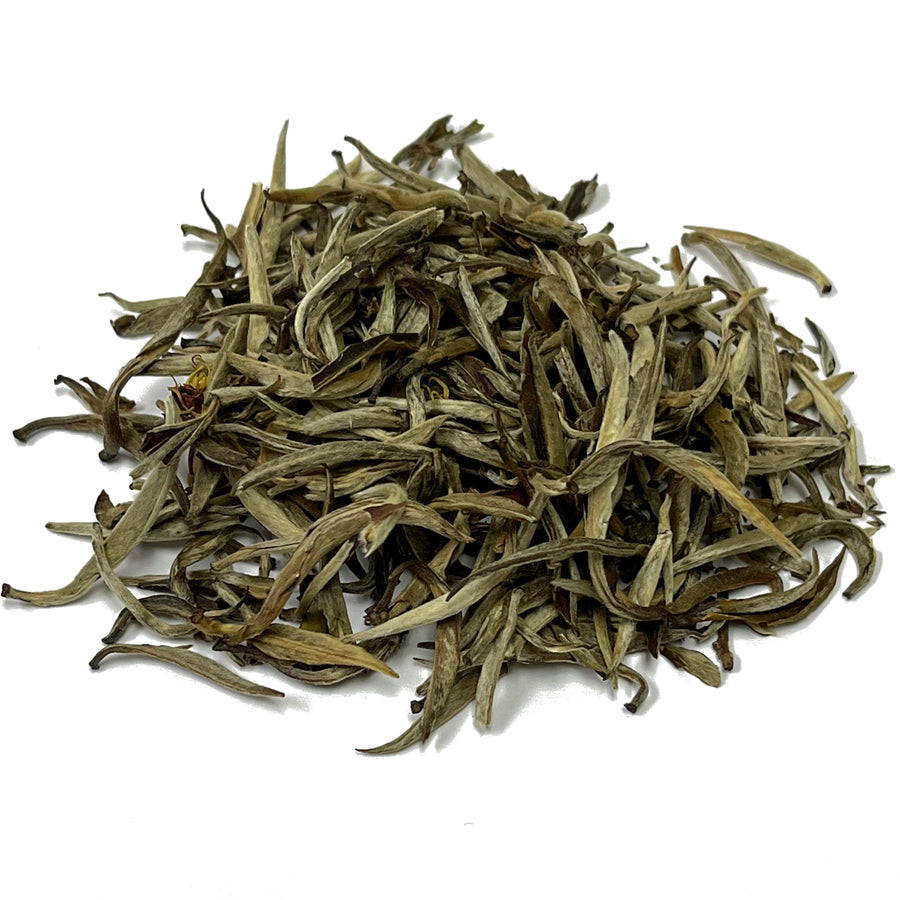 silver needle jasmine tea pile 